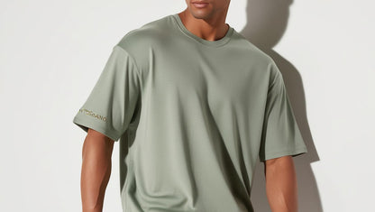 
Model wearing KyotoSagano 001 Classic Crew Neck T-shirt in Kyoto Sage ultra-soft bamboo fabric with matte gold logo on sleeve, shot in clean studio lighting.
